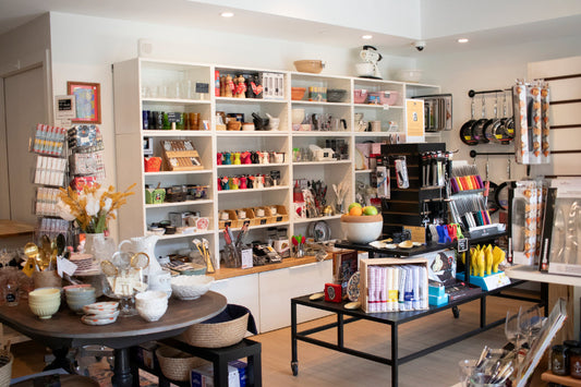 A range of kitchenware products on the shelves of the main room inside Saffron + Salt Kitchenware.